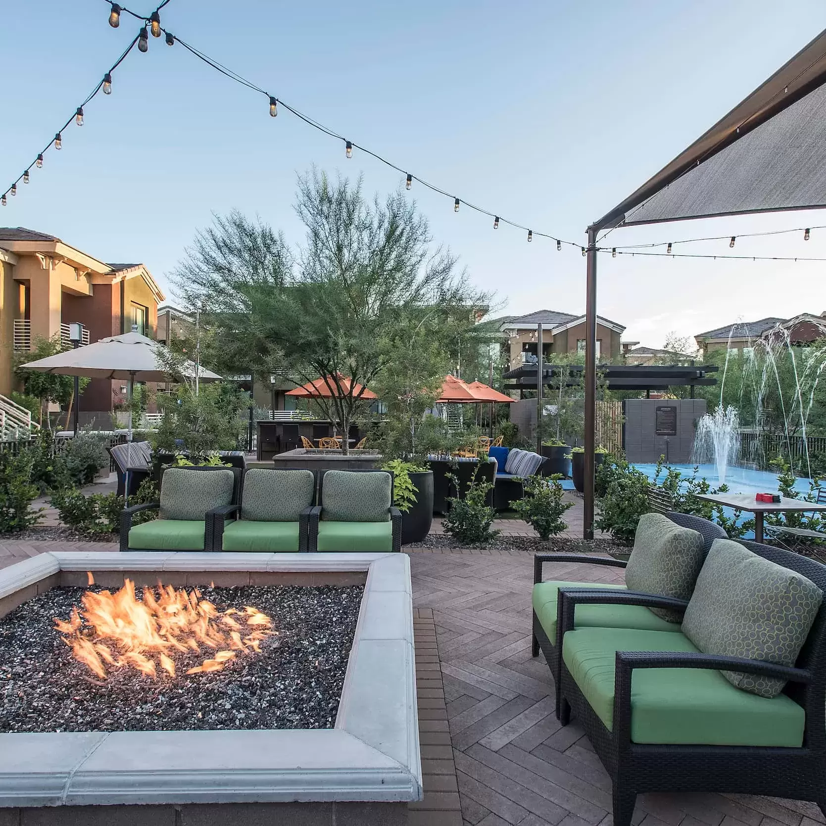 Chairs surround a firepit on the patio at the Liv Ahwatukee apartment complex.